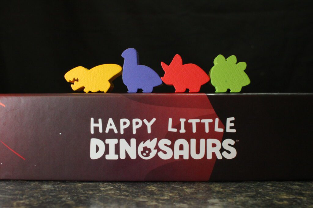 The four board game pieces that come with the game