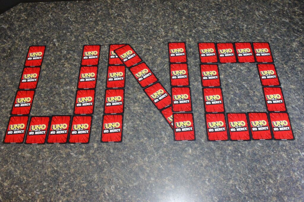 UNO: Show 'Em No Mercy "Uno spelled out with uno cards"